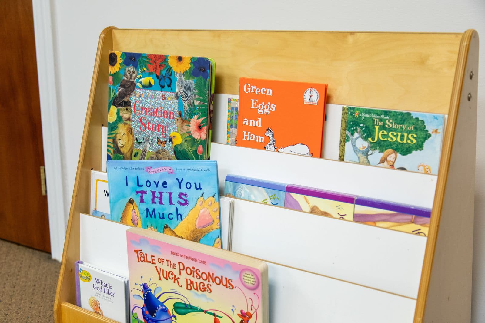A shelf of picture books in a classroom